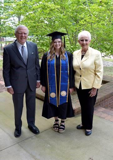 REACH Scholar and University of North Georgia graduate Laura Vinson (center) with former Governor Nathan Deal (left) and former First Lady Sandra Deal.