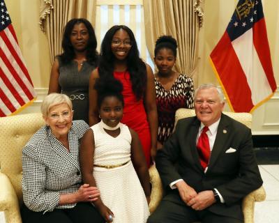 August 2018 Quarterly Newsletter Val Reception 2018 - Deal w family_0.jpg